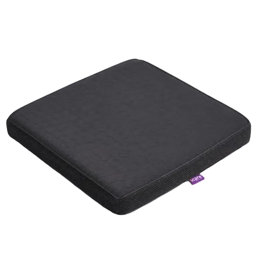 A charcoal icare Supporta ThermoPad Seat cushion or seat pad with a small purple tag on the side, photographed on a clean light gray background.