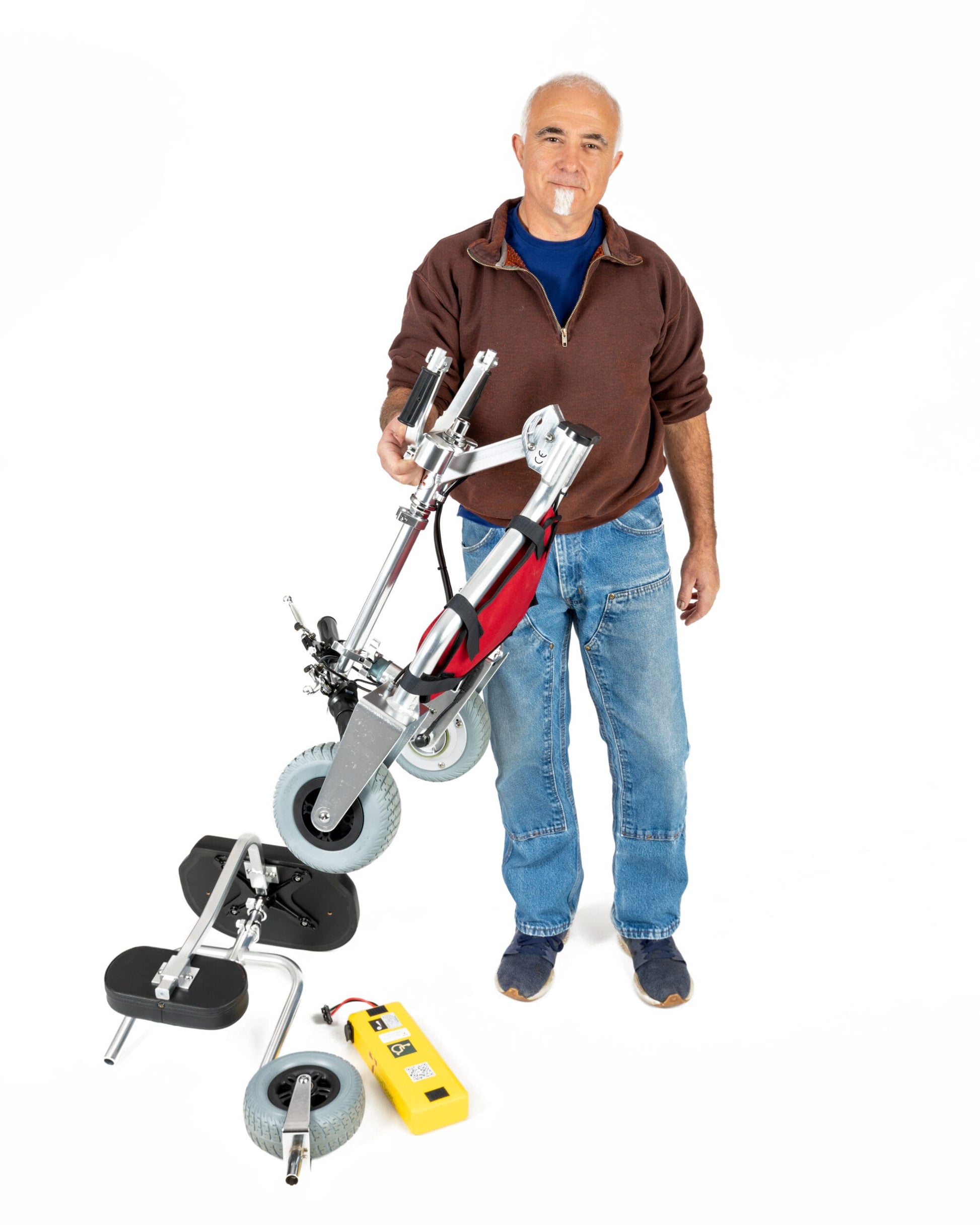 TravelScoot Escape Ultralight Travel Scooter being carried