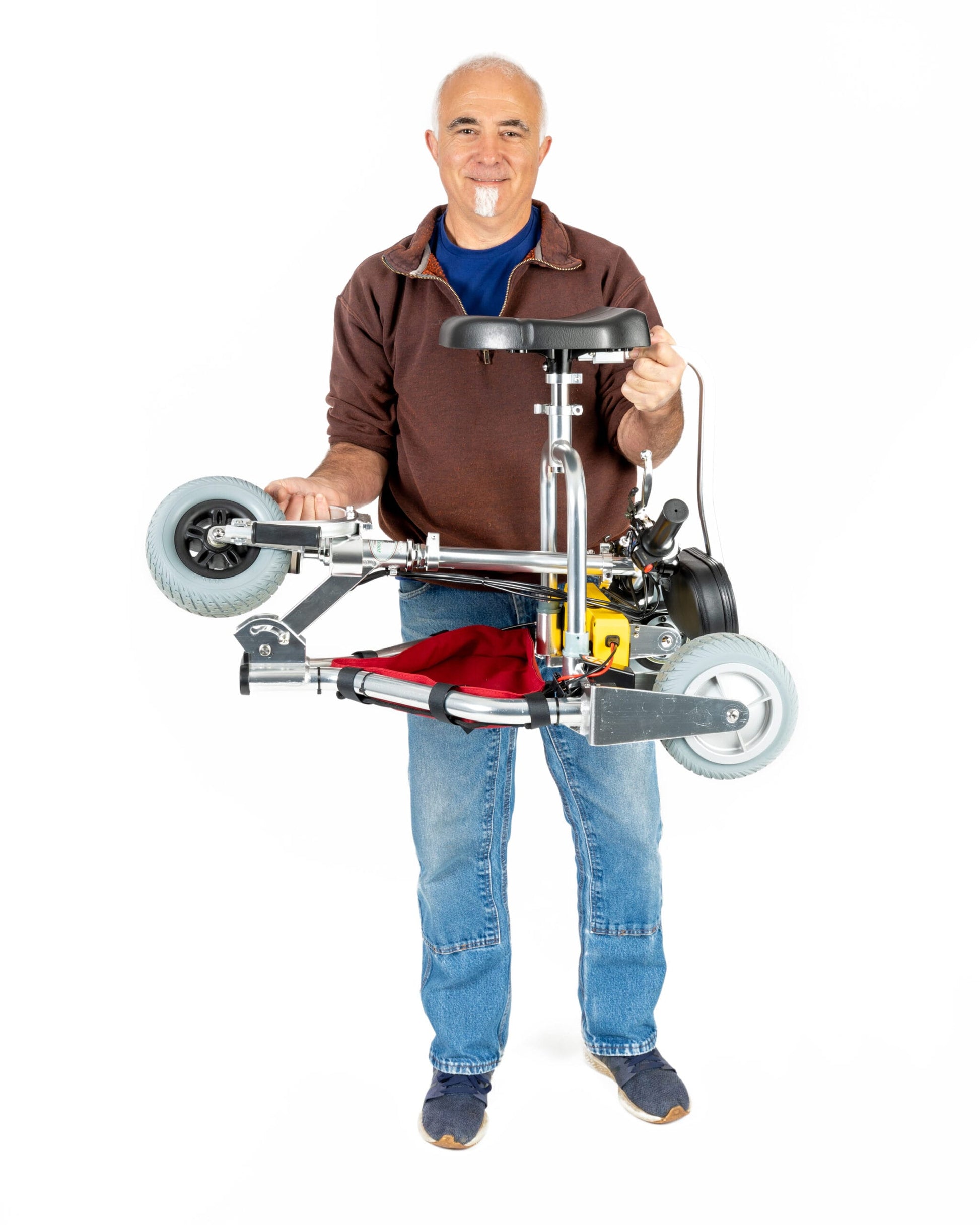 TravelScoot Escape Ultralight Travel Scooter being carried