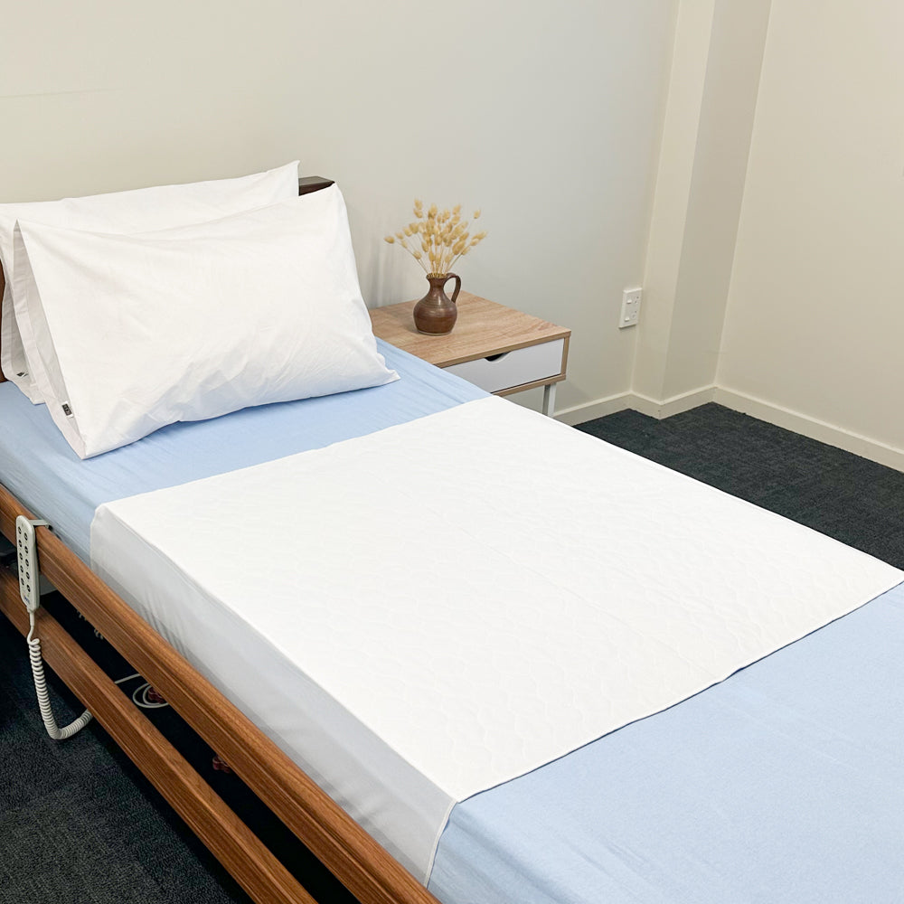 Absorb Plus Super Bed Pad with Flaps (1500ml) on bed