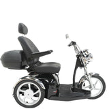 A black three-wheeled Pride Sport Rider mobility scooter with a high backrest seat, armrests, a storage trunk, and chrome accents, shown against a plain white background.