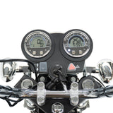 Close-up of a Pride Sport Rider dashboard with two round digital instrument gauges, chrome handlebars, and mirrors on a white background.