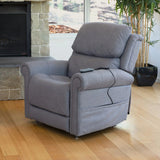 Theorem Studio Power Lift Recliner Chair in a living room setting with a fireplace and potted plant.