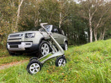 byACRE Carbon Overland Walker outdoors next to Landrover Defender Green