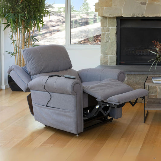 Theorem Studio Power Lift Recliner Chair Smoke in a living room with a fireplace and large windows.