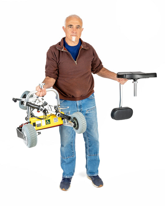 TravelScoot Escape Ultralight Travel Scooter being carried