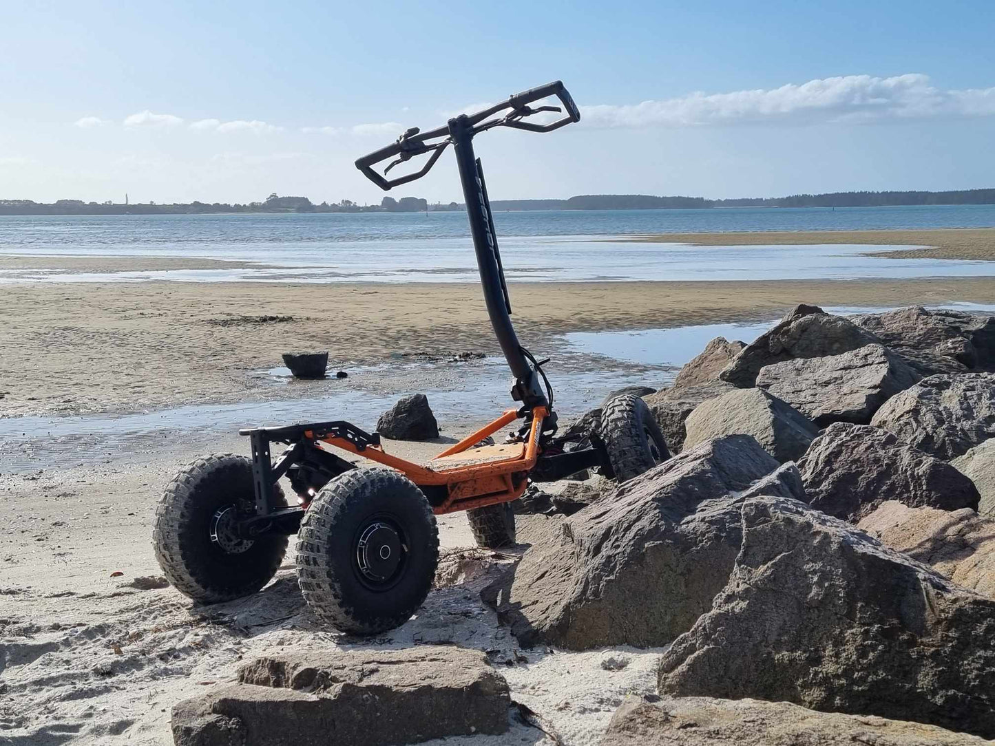 Veehop Electric ATV orange on beach
