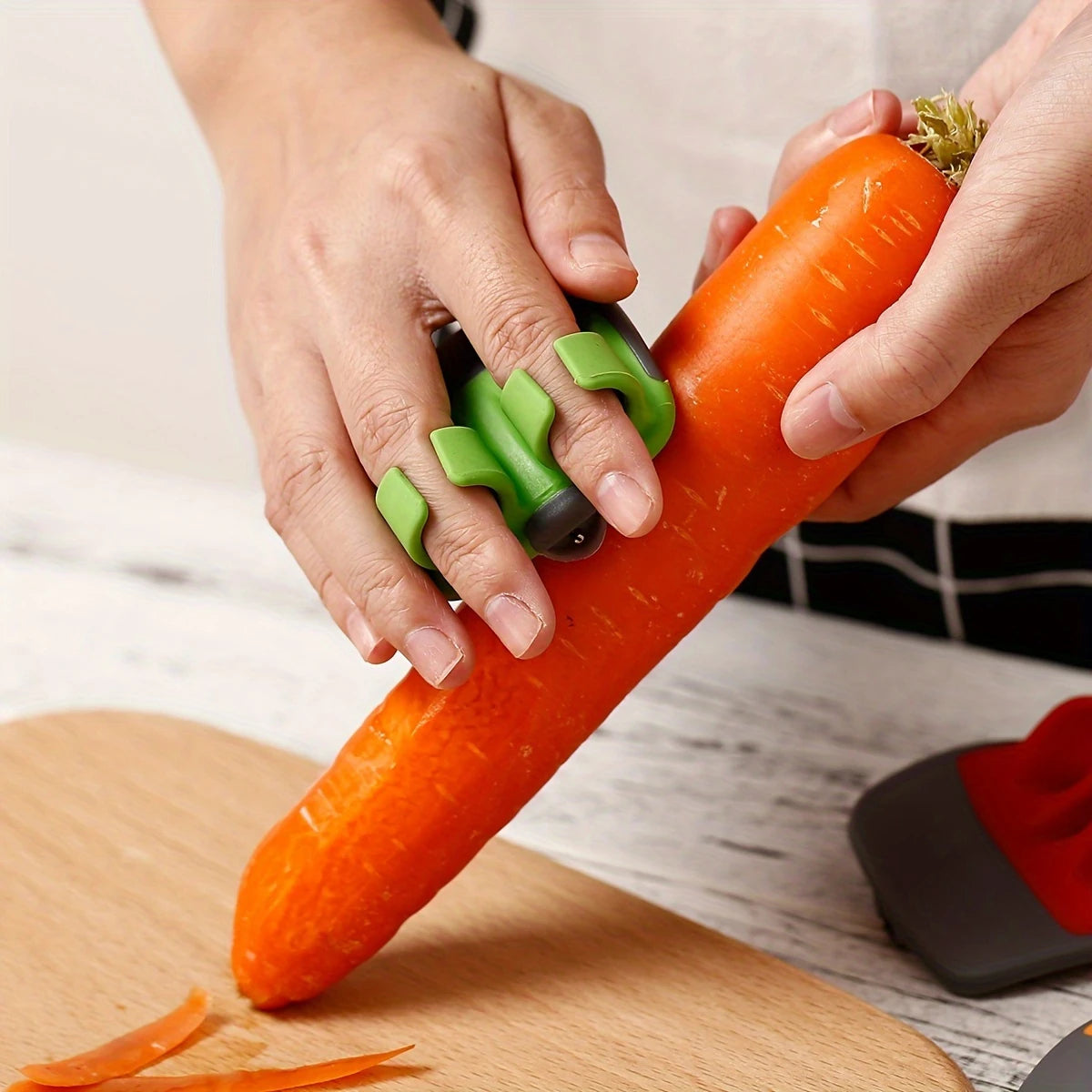 Ergonomic Vegetable Peeler (no grip required) peeling a carrot