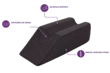 A charcoal icare Leg Raiser shown on a white background with purple callout lines and text explaining its features: 'Elevates & Supports,' 'Contoured Leg Cradle,' and 'Reduces Lower Back Strain.'.