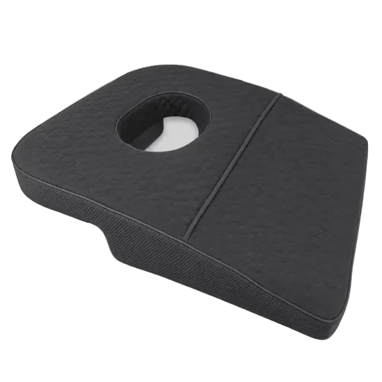 A charcoal icare Supporta Rotator Cuff Recovery Pillow with a circular cutout, shown on a neutral light gray background.