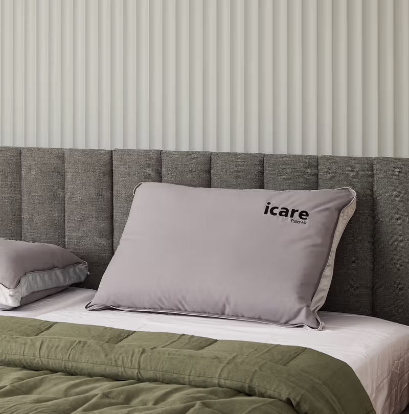 icare Conform Pillow on a bed
