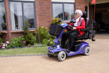 AMW Explorer Scooter outside house