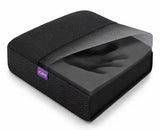 A charcoal icare Supporta Seat Cushion with a textured fabric cover, shown with its transparent protective plastic lid partially peeled back to reveal the contoured foam insert.
