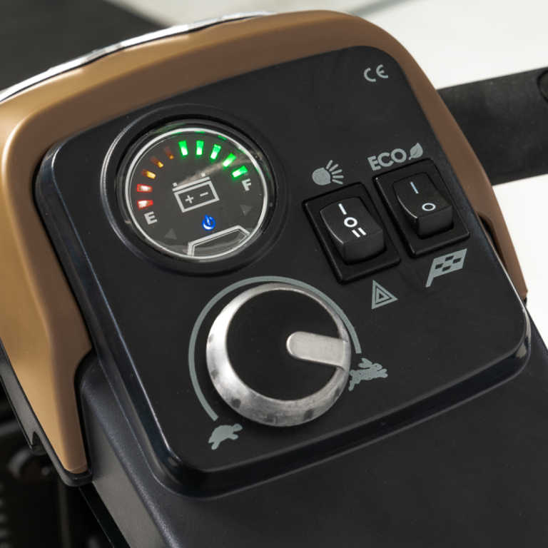 Control panel with gauge and buttons on a Pride Mobility Baja Bandit Mobility Scooter