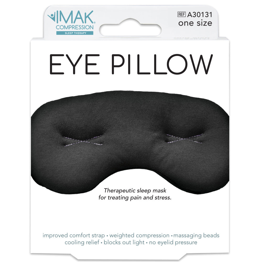 Black eye pillow packaging with IMAK Compression branding on a white background