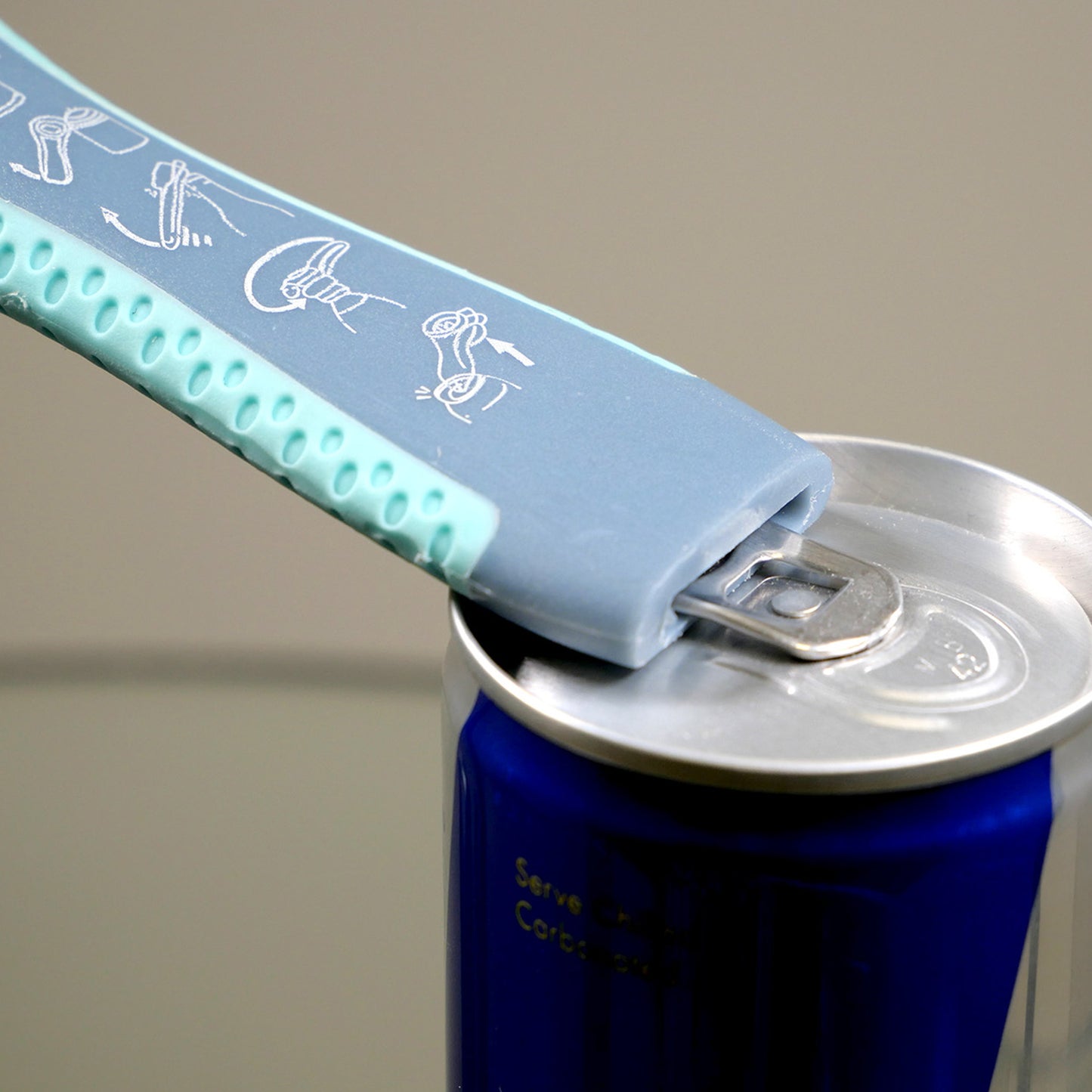 Canned drink being opened with a Goldfern GripMate Jar and Bottle Opener 