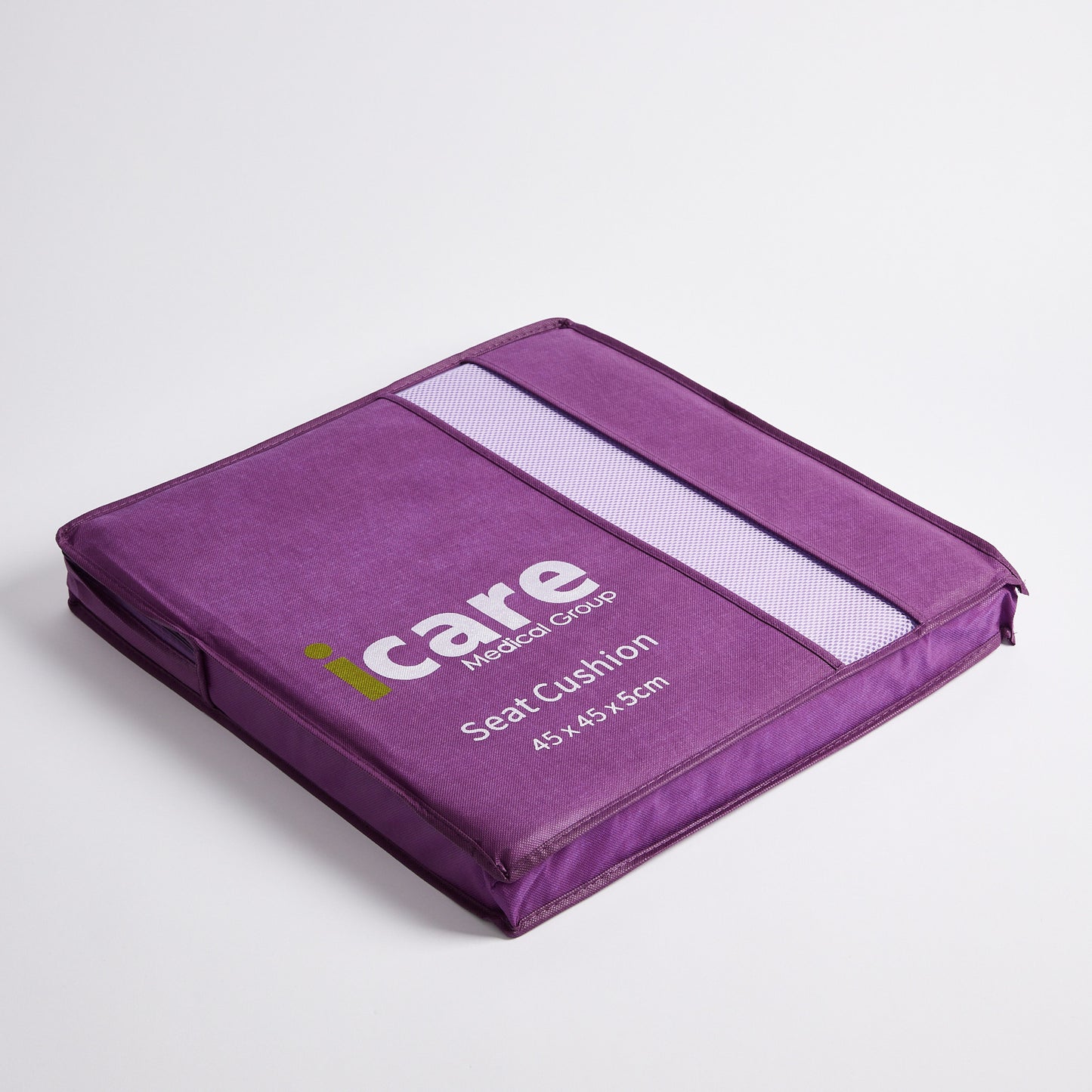 A purple 5cm icare Supporta Seat Cushion and printed branding, photographed on a clean light gray studio background.
