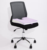 A black mesh office chair purple icare Coccyx Wedge on the seat, set against a plain white studio background.