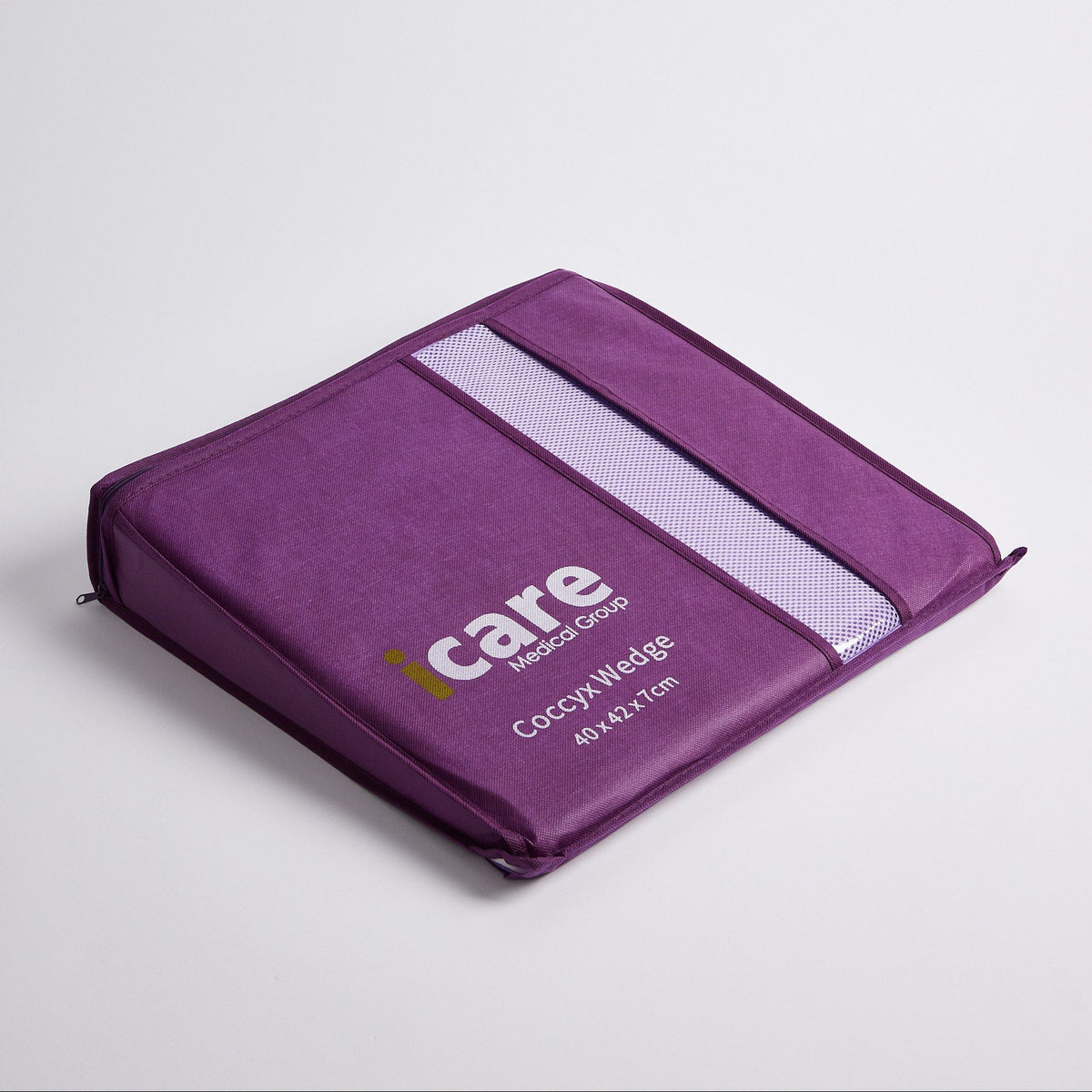 A purple icare Coccyx Wedge with a white reflective stripe and white printed branding, shown on a light gray background.