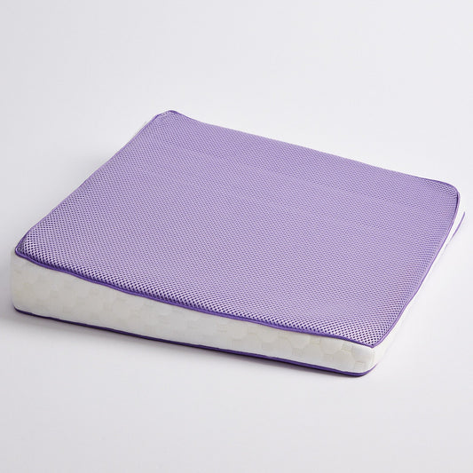 A purple icare Posture Wedge with a white side bolster, shown on a clean white background.