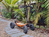 Veehop Electric ATV Orange in garden