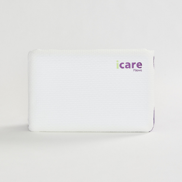 White icare Classic Pillow with 'icare' branding on a light gray background