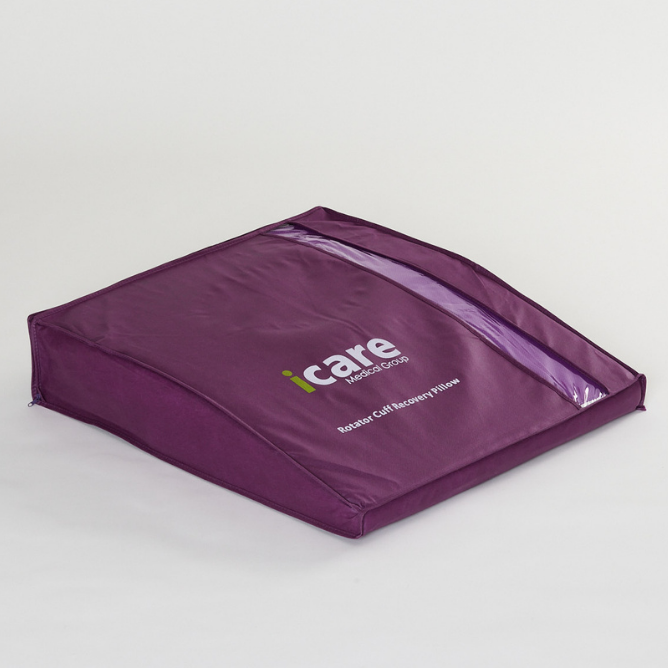 Purple icare Supporta Rotator Cuff Recovery Pillow with 'icare' branding on a light gray background