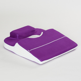 Purple icare Supporta Rotator Cuff Recovery Pillow with a handle on a light gray background