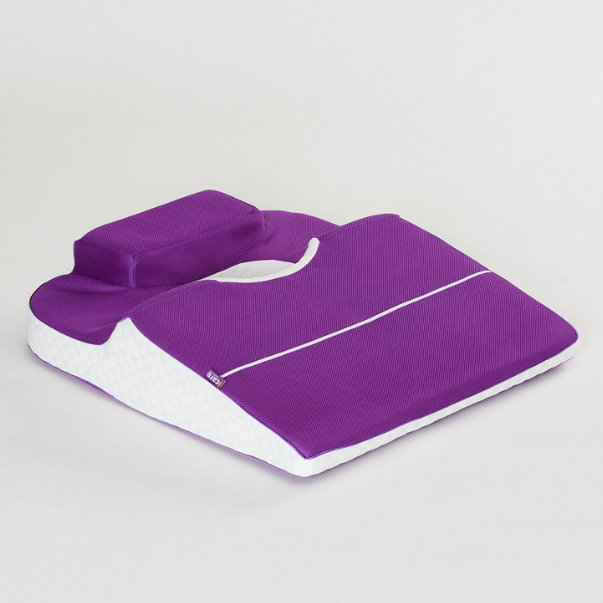 Purple icare Supporta Rotator Cuff Recovery Pillow with a handle on a light gray background