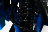 Close-up of a black suspension coil on a Pride Mobility Outback Mobility Scooter