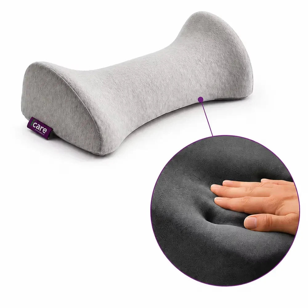 A light gray icare Reform Lumbar Support with a small purple C-GE tag, shown on a white background with a circular inset demonstrating the pillow's soft, compressible memory foam texture.