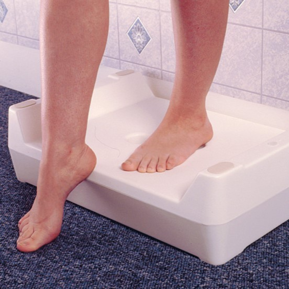 Ashby Bathroom Two Step showing the reversible two-height bath step in use