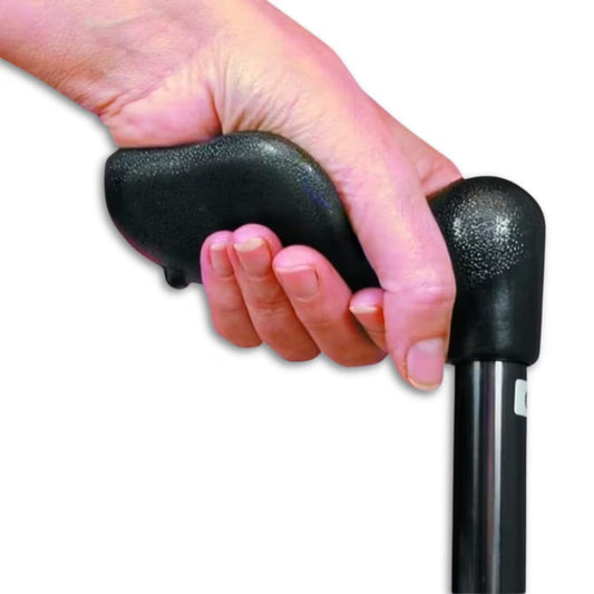 A close-up of a person's hand gripping a Strider Adjustable Fischer Support Stick, with the black cane pole visible below, on a plain white background.