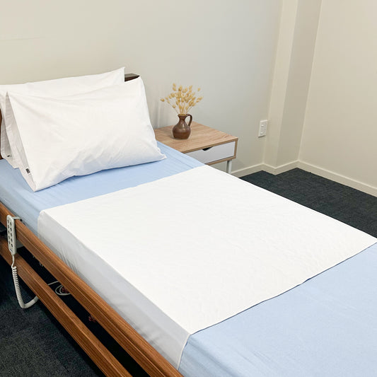 Absorb Plus Super Bed Pad with Flaps (1500ml) on bed