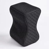 A charcoal icare Supporta Knee Cushion  with a textured mesh fabric cover and a quilted honeycomb pattern on the side, shown on a light gray background.