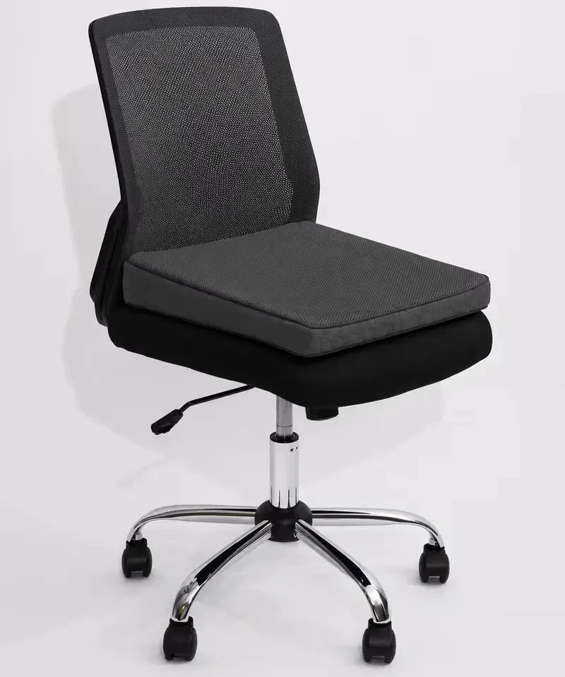 A modern office desk chair with a dark gray fabric mesh backrest, with a charcoal icare Posture Wedge, and a chrome five-star base with black casters, shown against a plain white background.