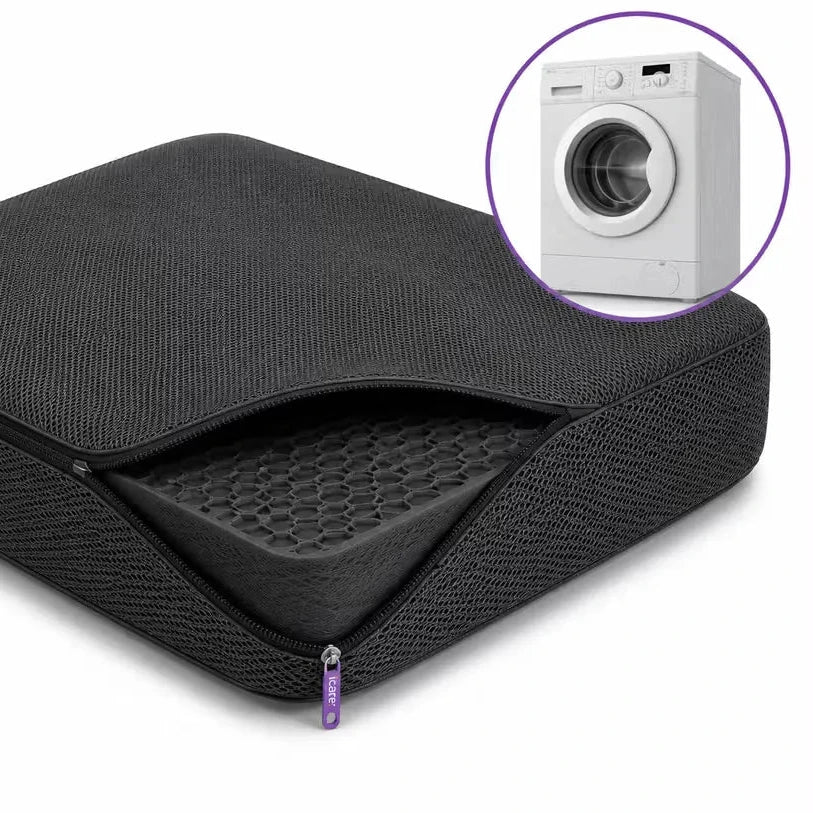 A charcoal icare Supporta Seat Cushion shown on a white background, with a small inset circle containing a white washing machine to suggest washable use.