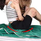 Person sitting on a Patient Transfer Slide Sheet with a red arrow pointing to their legs.