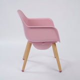 Spryly Poise commode chair in blossom with wooden legs side view